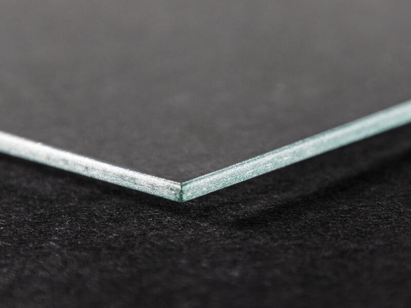 Close-up of the edge of a frame's glass pane